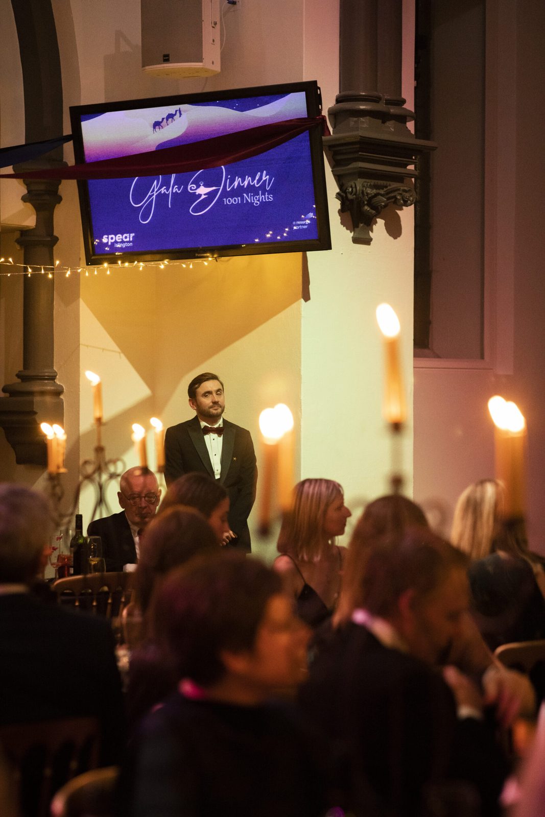 Kevin Durham hosting a black-tie corporate gala with interactive games