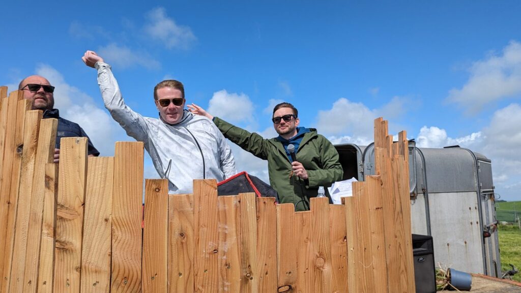 Kevin Durham on the microphone at an outdoor family fun day for the Dorset County Hospital Charity