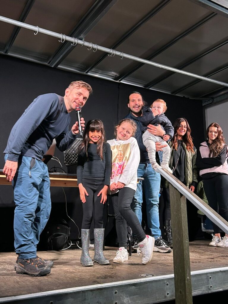 Kevin on a family festival stage with children and parents