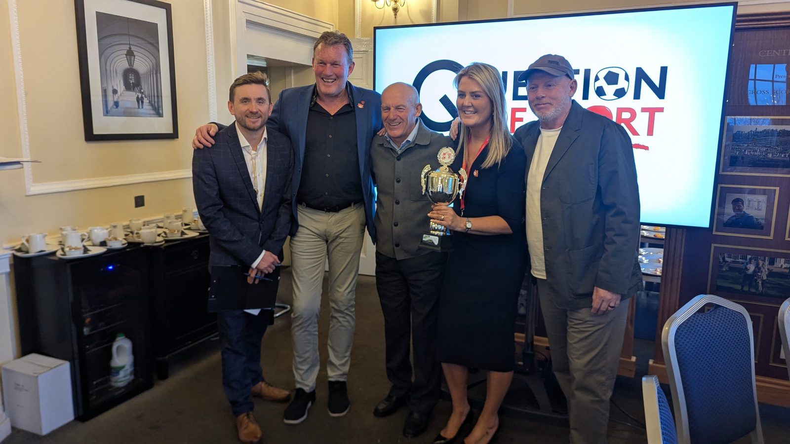 A corporate quiz night trophy presentation hosted by Kevin Durham