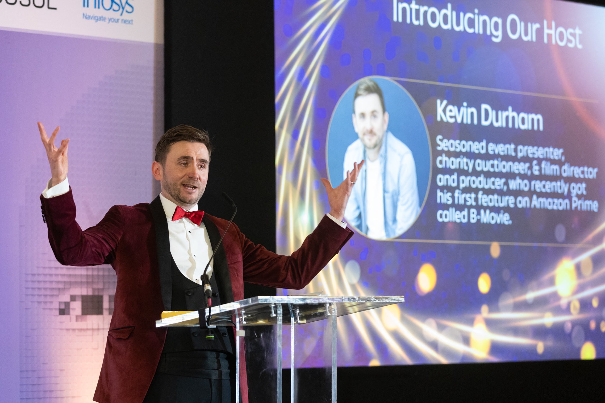 Kevin Durham hosting a corporate awards ceremony on stage